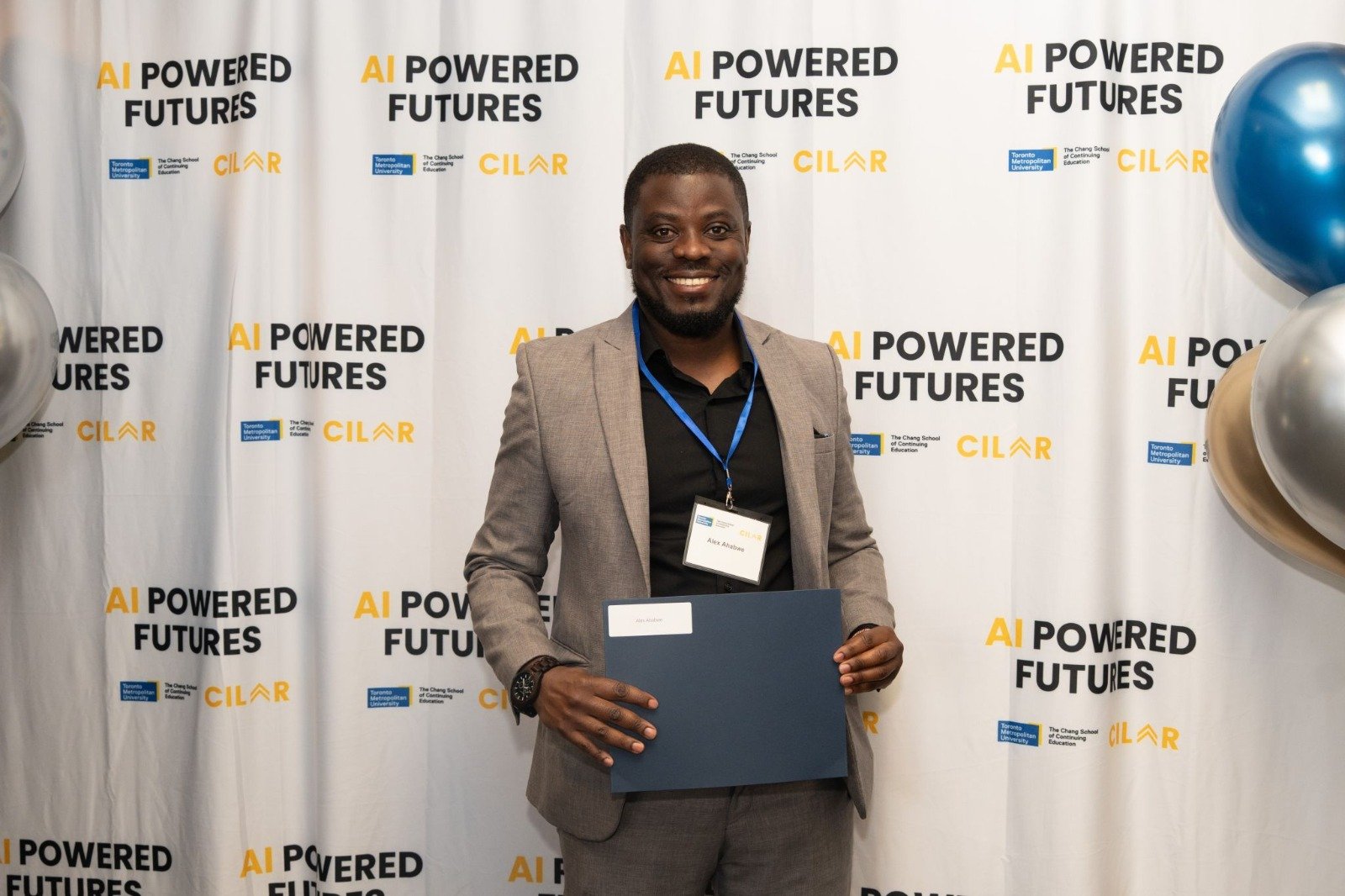 Alex Ahabwe at a Powered Futures recognition event